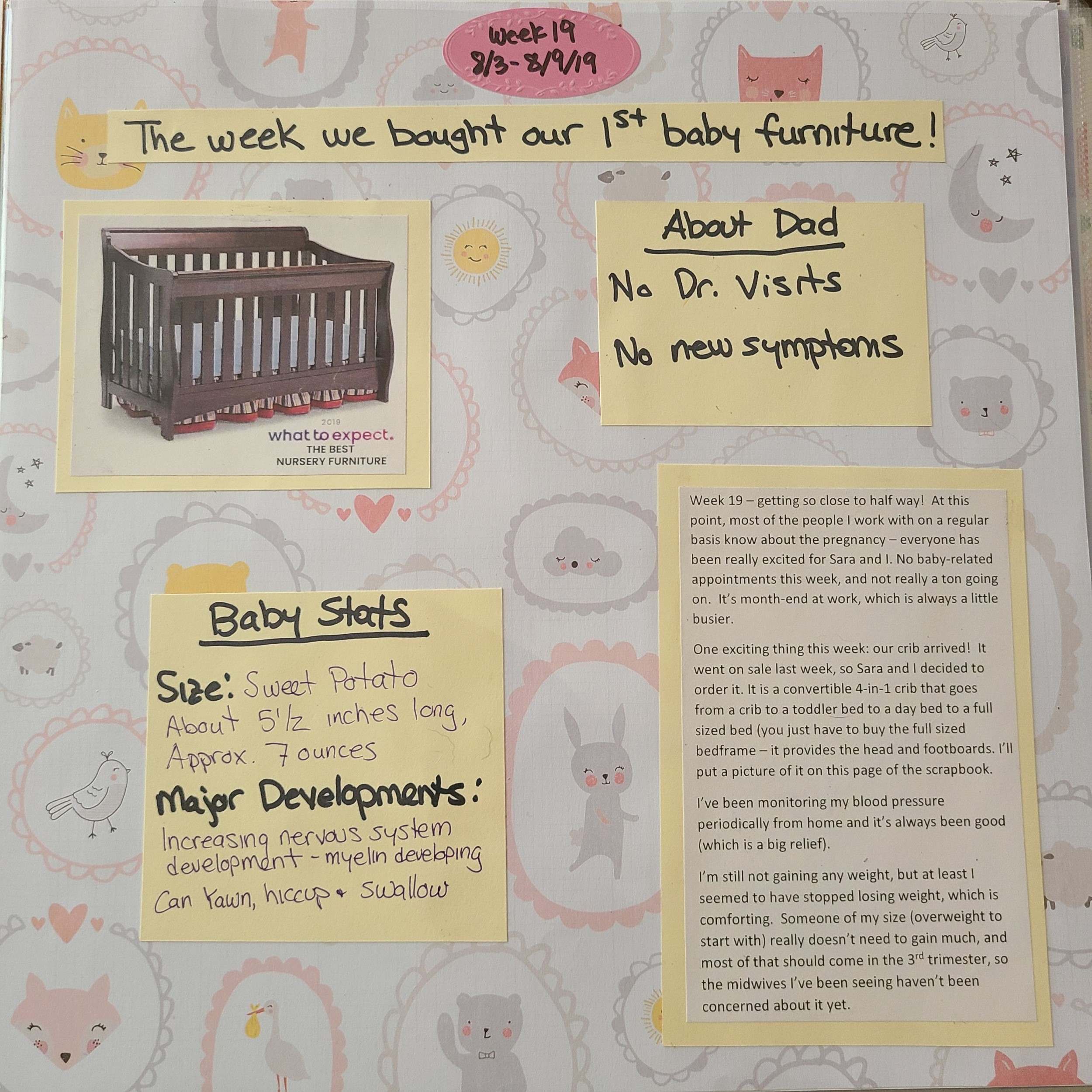 Week 19 scrapbook page - background includes various light pastel colored drawings of cute animals, clouds, the moon and sun.  There is a picture of a dark brown crib with a light blue mattress.